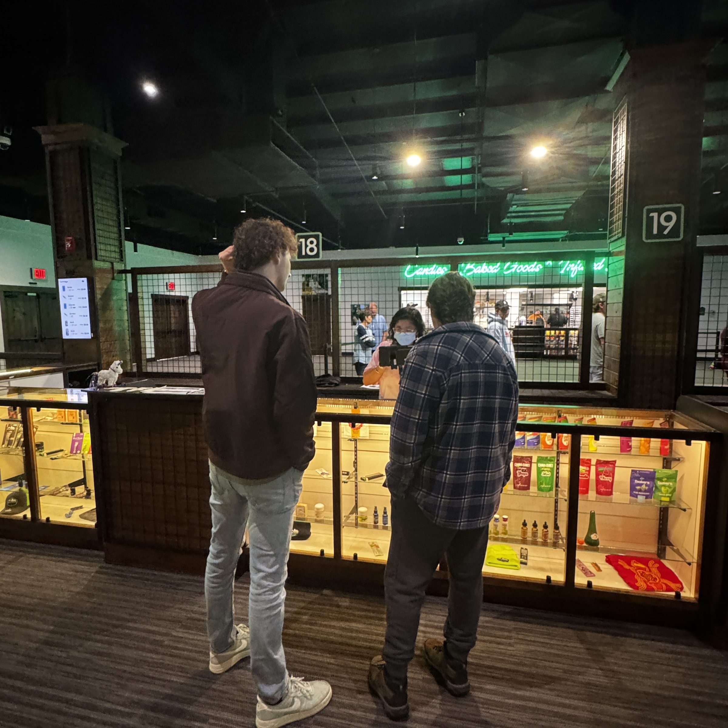 a man standing in front of a store